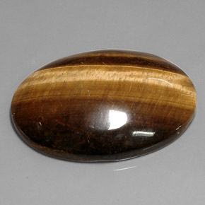 Tiger's Eye طبيعي بلون بني ذهبي، وزن ‎76.52‎ قيراط، شكل بيضاوى، مقاس ‎39.9x29.9‎ مم