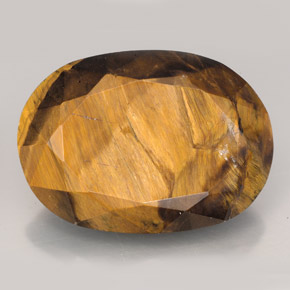 Tiger's Eye طبيعي بلون بني ذهبي، وزن ‎23.17‎ قيراط، شكل بيضاوى، مقاس ‎22.6x16.2‎ مم