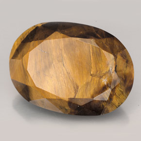 Tiger's Eye طبيعي بلون بني ذهبي، وزن ‎23.17‎ قيراط، شكل بيضاوى، مقاس ‎22.6x16.2‎ مم