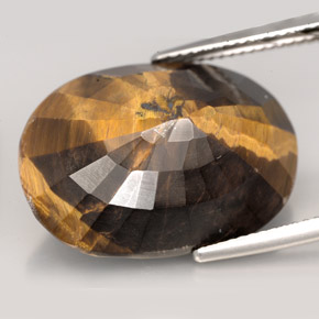 Tiger's Eye طبيعي بلون بني ذهبي، وزن ‎23.17‎ قيراط، شكل بيضاوى، مقاس ‎22.6x16.2‎ مم