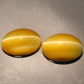 Tiger's Eye طبيعي بلون ذهبي، وزن ‎‎ قيراط، شكل بيضاوى، مقاس ‎14x10.1‎ مم