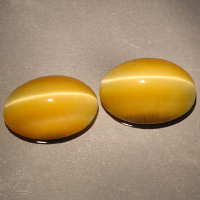 Tiger's Eye طبيعي بلون ذهبي، وزن ‎‎ قيراط، شكل بيضاوى، مقاس ‎14x10.1‎ مم