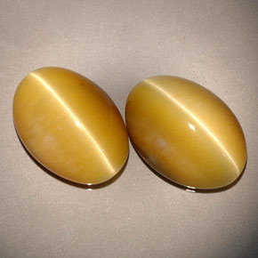 Tiger's Eye طبيعي بلون ذهبي، وزن ‎‎ قيراط، شكل بيضاوى، مقاس ‎13.8x9.8‎ مم
