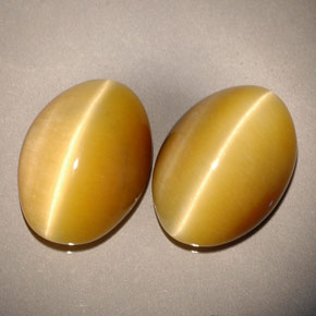 Tiger's Eye طبيعي بلون ذهبي، وزن ‎‎ قيراط، شكل بيضاوى، مقاس ‎13.8x9.8‎ مم