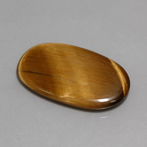 Tiger's Eye طبيعي بلون بني ذهبي، وزن ‎10.07‎ قيراط، شكل بيضاوى، مقاس ‎24.4x14.6‎ مم