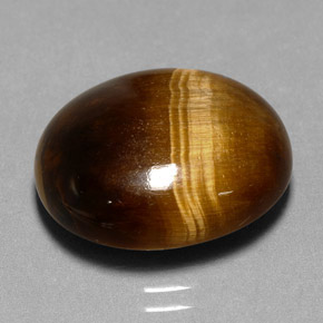 Tiger's Eye طبيعي بلون بني ذهبي، وزن ‎11.35‎ قيراط، شكل بيضاوى، مقاس ‎17.2x14.5‎ مم