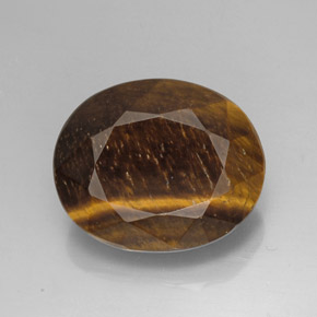 Tiger's Eye طبيعي بلون بني ذهبي، وزن ‎25.78‎ قيراط، شكل بيضاوى، مقاس ‎21.4x17.5‎ مم