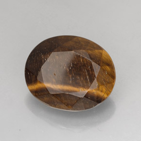 Tiger's Eye طبيعي بلون بني ذهبي، وزن ‎25.78‎ قيراط، شكل بيضاوى، مقاس ‎21.4x17.5‎ مم