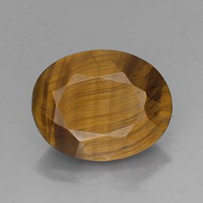 Tiger's Eye طبيعي بلون بني ذهبي، وزن ‎14.10‎ قيراط، شكل بيضاوى، مقاس ‎18.6x14.7‎ مم
