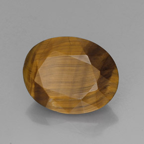 Tiger's Eye طبيعي بلون بني ذهبي، وزن ‎14.10‎ قيراط، شكل بيضاوى، مقاس ‎18.6x14.7‎ مم