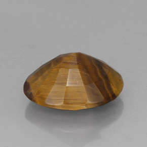 Tiger's Eye طبيعي بلون بني ذهبي، وزن ‎14.10‎ قيراط، شكل بيضاوى، مقاس ‎18.6x14.7‎ مم