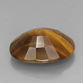 Tiger's Eye طبيعي بلون بني ذهبي، وزن ‎18.43‎ قيراط، شكل بيضاوى، مقاس ‎21.3x15.4‎ مم