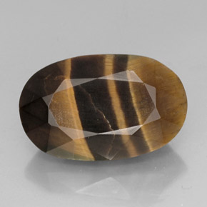Tiger's Eye طبيعي بلون متعدد الألوان، وزن ‎13.19‎ قيراط، شكل بيضاوى، مقاس ‎19.7x12.5‎ مم
