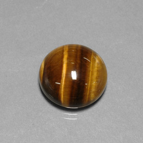 Tiger's Eye طبيعي بلون بني ذهبي، وزن ‎11.77‎ قيراط، شكل دائري، مقاس ‎14.85‎ مم
