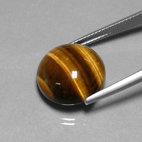 Tiger's Eye طبيعي بلون بني ذهبي، وزن ‎11.77‎ قيراط، شكل دائري، مقاس ‎14.85‎ مم