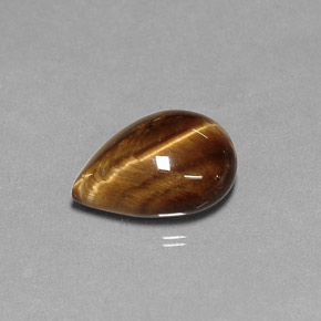 Tiger's Eye طبيعي بلون بني ذهبي، وزن ‎5.18‎ قيراط، شكل شكل الكمثرى، مقاس ‎14.1x10.1‎ مم