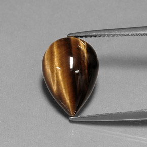 Tiger's Eye طبيعي بلون بني ذهبي، وزن ‎5.27‎ قيراط، شكل شكل الكمثرى، مقاس ‎14.1x10.1‎ مم