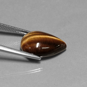 Tiger's Eye طبيعي بلون بني ذهبي، وزن ‎5.27‎ قيراط، شكل شكل الكمثرى، مقاس ‎14.1x10.1‎ مم
