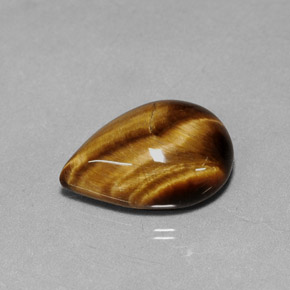 Tiger's Eye طبيعي بلون بني ذهبي، وزن ‎5.02‎ قيراط، شكل شكل الكمثرى، مقاس ‎14x10.1‎ مم