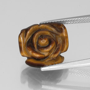 Tiger's Eye طبيعي بلون بني ذهبي، وزن ‎9.71‎ قيراط، شكل شكل خيالي، مقاس ‎15.1x14.9‎ مم