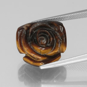 Tiger's Eye طبيعي بلون بني ذهبي، وزن ‎10.61‎ قيراط، شكل شكل خيالي، مقاس ‎15.6x15.2‎ مم