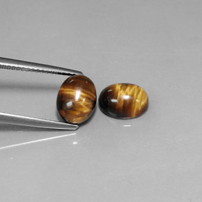 Tiger's Eye طبيعي بلون بني ذهبي، وزن ‎‎ قيراط، شكل بيضاوى، مقاس ‎8.9x6.9‎ مم