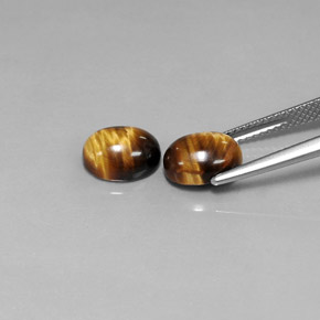 Tiger's Eye طبيعي بلون بني ذهبي، وزن ‎‎ قيراط، شكل بيضاوى، مقاس ‎8.9x6.9‎ مم