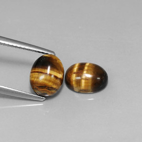 أحجار عين النمر ذهب البنى طبيعية، قصة بيضاوى، غير شفاف، وزنها  قيراط