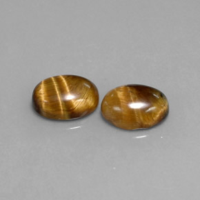 Tiger's Eye طبيعي بلون بني ذهبي، وزن ‎‎ قيراط، شكل بيضاوى، مقاس ‎8.9x6.9‎ مم