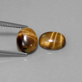 Tiger's Eye طبيعي بلون بني ذهبي، وزن ‎‎ قيراط، شكل بيضاوى، مقاس ‎8.9x6.9‎ مم