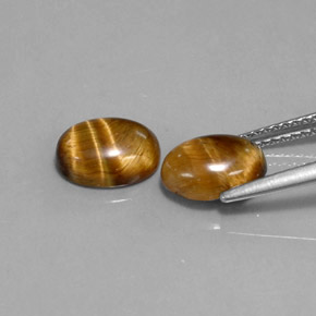 Tiger's Eye طبيعي بلون بني ذهبي، وزن ‎‎ قيراط، شكل بيضاوى، مقاس ‎8.9x6.9‎ مم