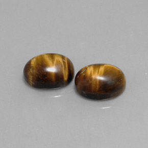 Tiger's Eye طبيعي بلون بني ذهبي، وزن ‎‎ قيراط، شكل بيضاوى، مقاس ‎9x7‎ مم