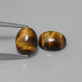 Tiger's Eye طبيعي بلون بني ذهبي، وزن ‎‎ قيراط، شكل بيضاوى، مقاس ‎9x7‎ مم
