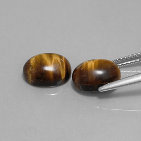 Tiger's Eye طبيعي بلون بني ذهبي، وزن ‎‎ قيراط، شكل بيضاوى، مقاس ‎9x7‎ مم