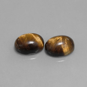 Tiger's Eye طبيعي بلون بني ذهبي، وزن ‎‎ قيراط، شكل بيضاوى، مقاس ‎9x7.1‎ مم