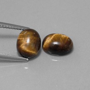 Tiger's Eye طبيعي بلون بني ذهبي، وزن ‎‎ قيراط، شكل بيضاوى، مقاس ‎9x7.1‎ مم