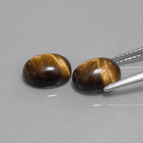 Tiger's Eye طبيعي بلون بني ذهبي، وزن ‎‎ قيراط، شكل بيضاوى، مقاس ‎9x7.1‎ مم