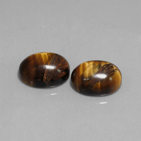 Tiger's Eye طبيعي بلون بني ذهبي، وزن ‎‎ قيراط، شكل بيضاوى، مقاس ‎9.1x7.1‎ مم