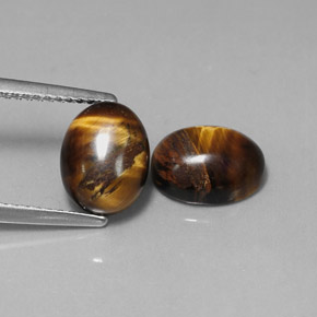 Tiger's Eye طبيعي بلون بني ذهبي، وزن ‎‎ قيراط، شكل بيضاوى، مقاس ‎9.1x7.1‎ مم