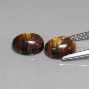 Tiger's Eye طبيعي بلون بني ذهبي، وزن ‎‎ قيراط، شكل بيضاوى، مقاس ‎9.1x7.1‎ مم
