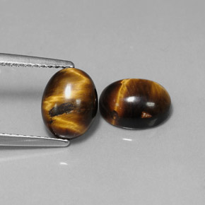 Tiger's Eye طبيعي بلون بني ذهبي، وزن ‎‎ قيراط، شكل بيضاوى، مقاس ‎8.8x6.9‎ مم