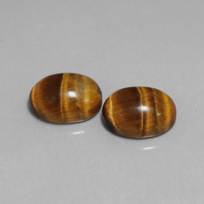 Tiger's Eye طبيعي بلون بني ذهبي، وزن ‎‎ قيراط، شكل بيضاوى، مقاس ‎9x7‎ مم