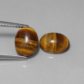 Tiger's Eye طبيعي بلون بني ذهبي، وزن ‎‎ قيراط، شكل بيضاوى، مقاس ‎9x7‎ مم