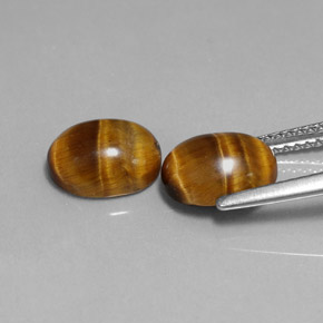 Tiger's Eye طبيعي بلون بني ذهبي، وزن ‎‎ قيراط، شكل بيضاوى، مقاس ‎9x7‎ مم