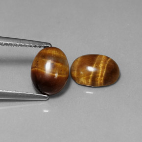 Tiger's Eye طبيعي بلون بني ذهبي، وزن ‎‎ قيراط، شكل بيضاوى، مقاس ‎8.7x6.7‎ مم