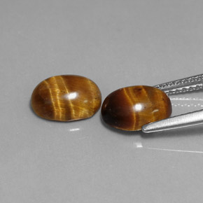 Tiger's Eye طبيعي بلون بني ذهبي، وزن ‎‎ قيراط، شكل بيضاوى، مقاس ‎8.7x6.7‎ مم