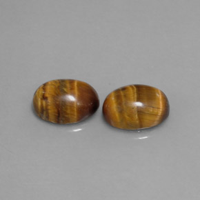 Tiger's Eye طبيعي بلون بني ذهبي، وزن ‎‎ قيراط، شكل بيضاوى، مقاس ‎8.8x6.9‎ مم