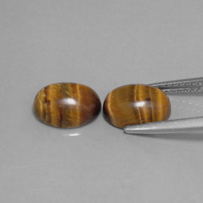 Tiger's Eye طبيعي بلون بني ذهبي، وزن ‎‎ قيراط، شكل بيضاوى، مقاس ‎8.8x6.9‎ مم