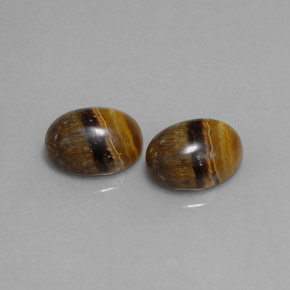 Tiger's Eye طبيعي بلون بني ذهبي، وزن ‎‎ قيراط، شكل بيضاوى، مقاس ‎8.9x7‎ مم
