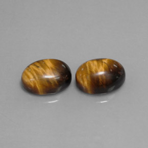 Tiger's Eye طبيعي بلون بني ذهبي، وزن ‎‎ قيراط، شكل بيضاوى، مقاس ‎9x7‎ مم